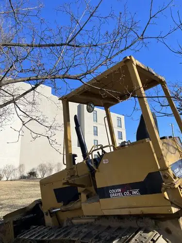 Sun-drenched iron beast awaits its next task.